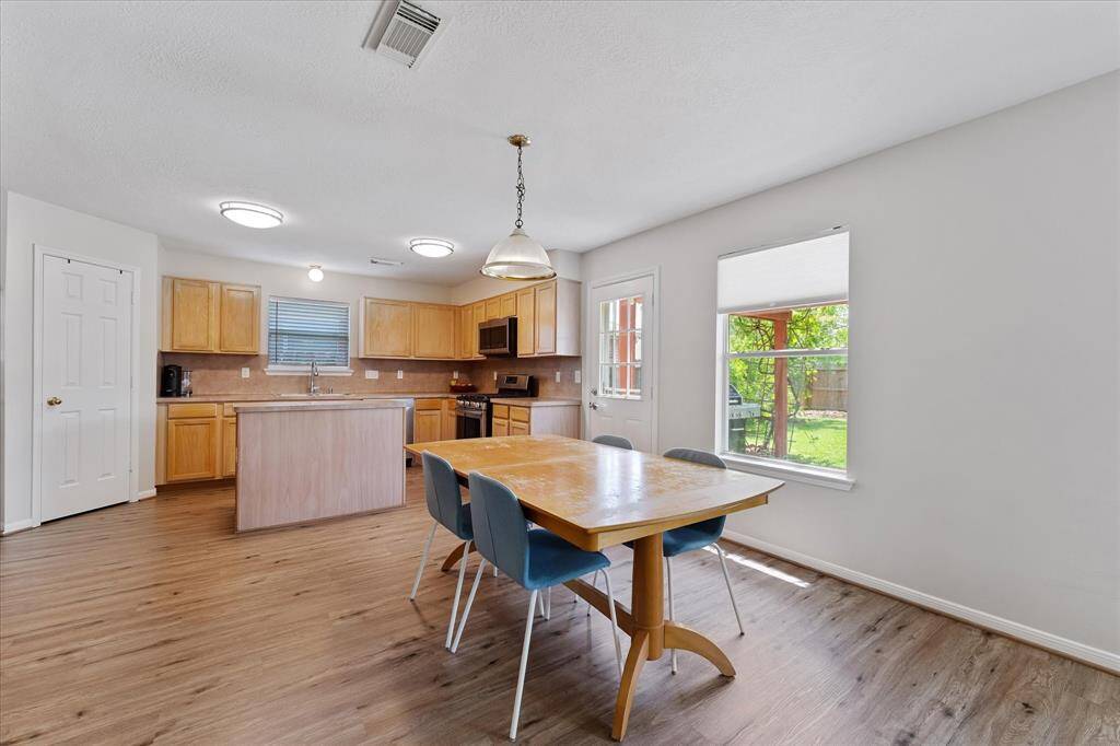 Large eat in breakfast area with access to the covered back patio. Perfect for BBQ's.