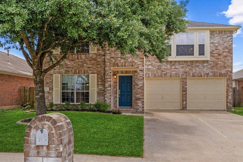 Large 2-story home with inviting entrance.