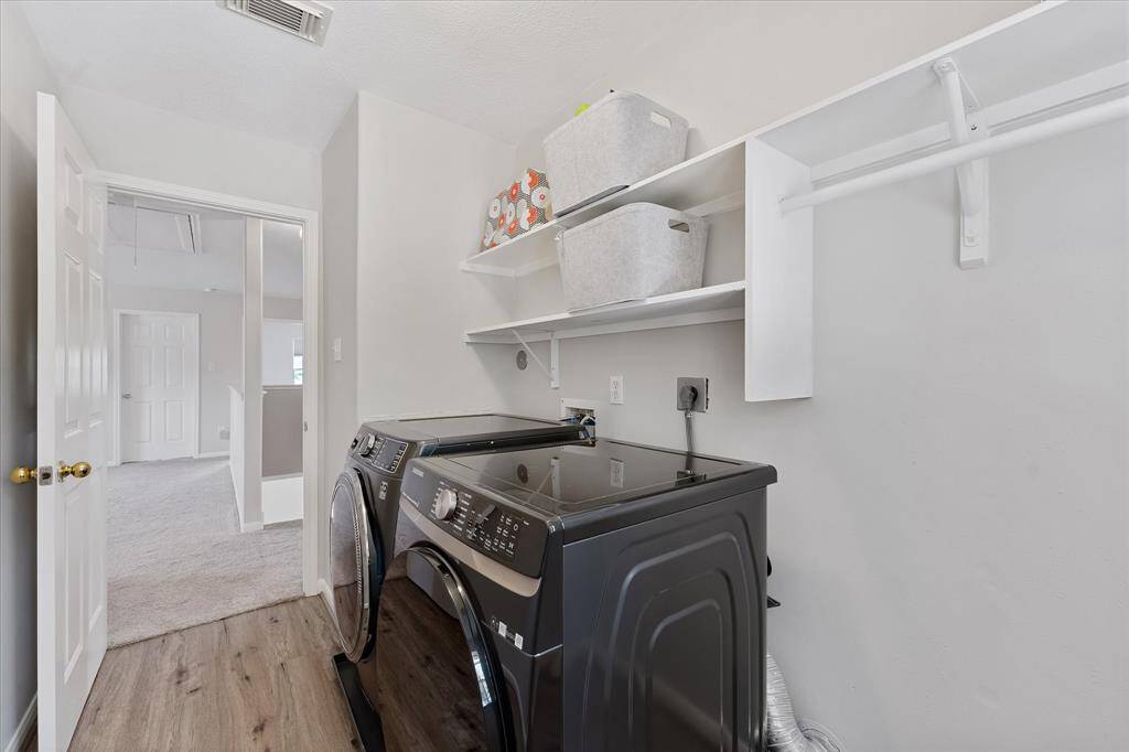 Washer & dryer can stay. What a great sized laundry room!