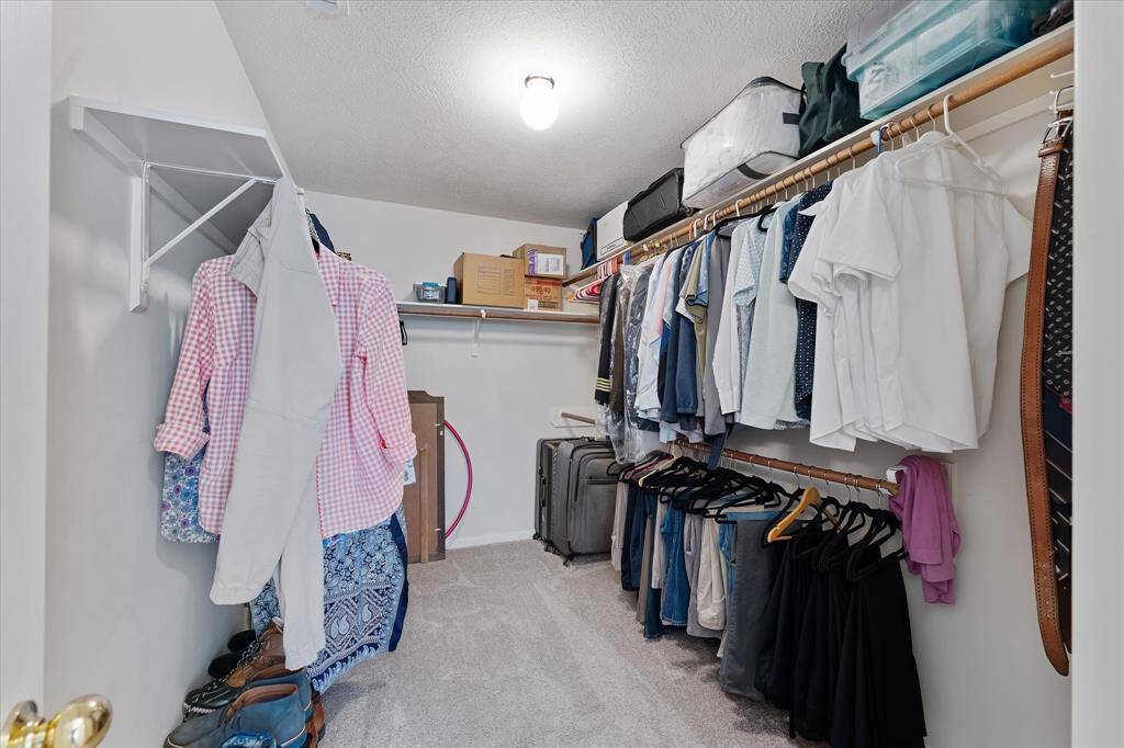 GIGANTIC walk-in closet in the primary suite.