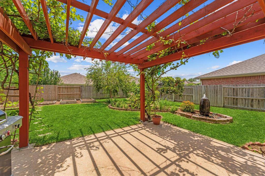 What a backyard! Above ground plant/veggie boxes are waiting for you to create your own garden.