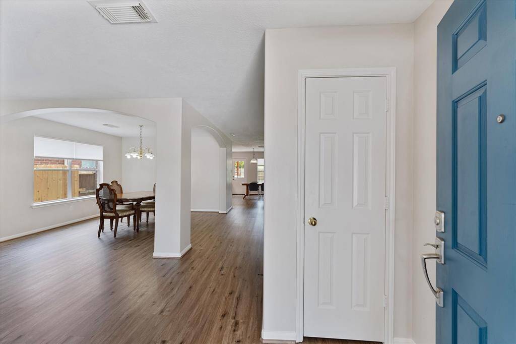 Updated LVP flooring flows through the main living areas.
