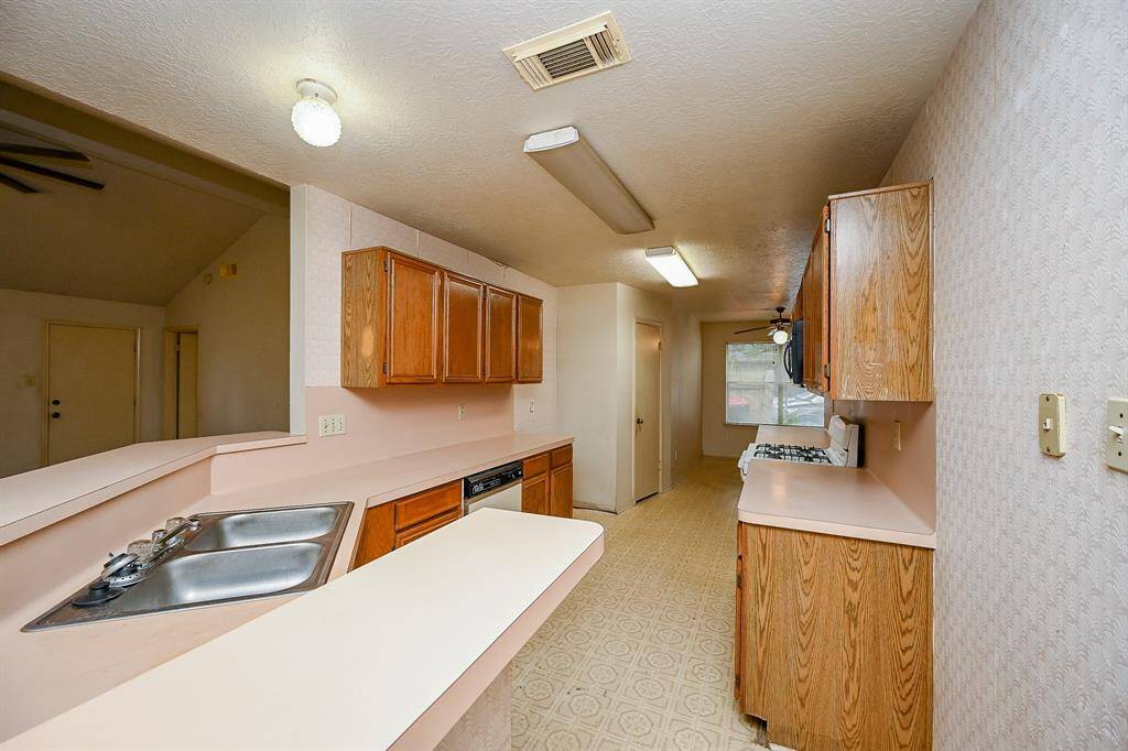 The Kitchen is open to the Family Room, so it is easy to chat with guests or keep an eye on the kids while you cook dinner.
