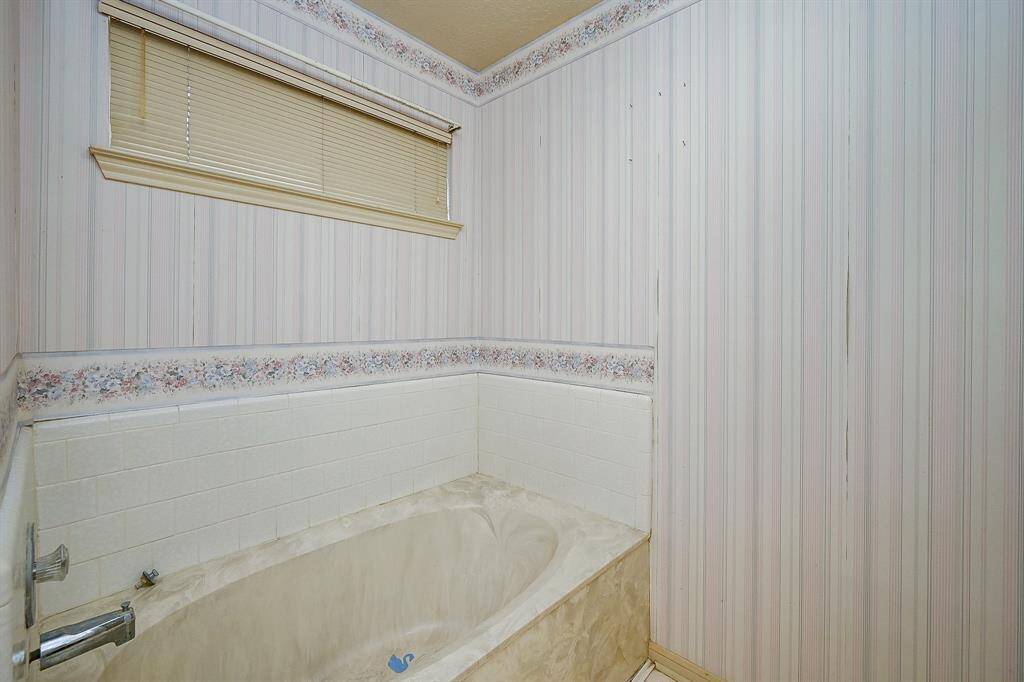 The tub area is large enough to accommodate a free standing tub if you prefer that look.
