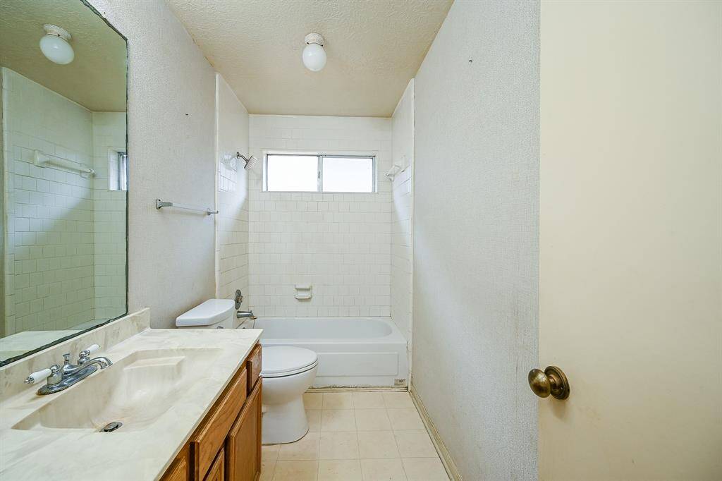 The secondary bath is also spacious and bright with natural light coming through the window.  It would be easy to add double sinks in here as well if nobody wants to share.