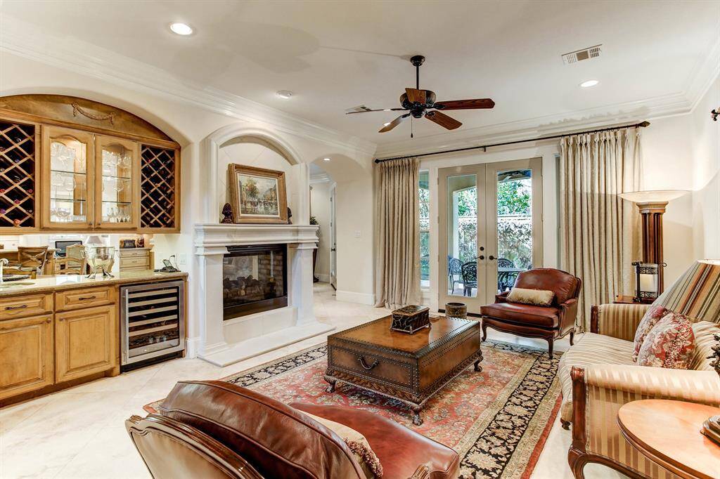 Another view of the living room with emphasis on the fireplace and bar area.