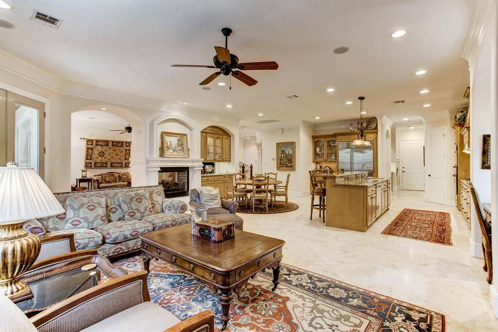This spacious open-concept design seamlessly integrates comfort and style, featuring a cozy sitting space, a breakfast area, and a chef's kitchen.