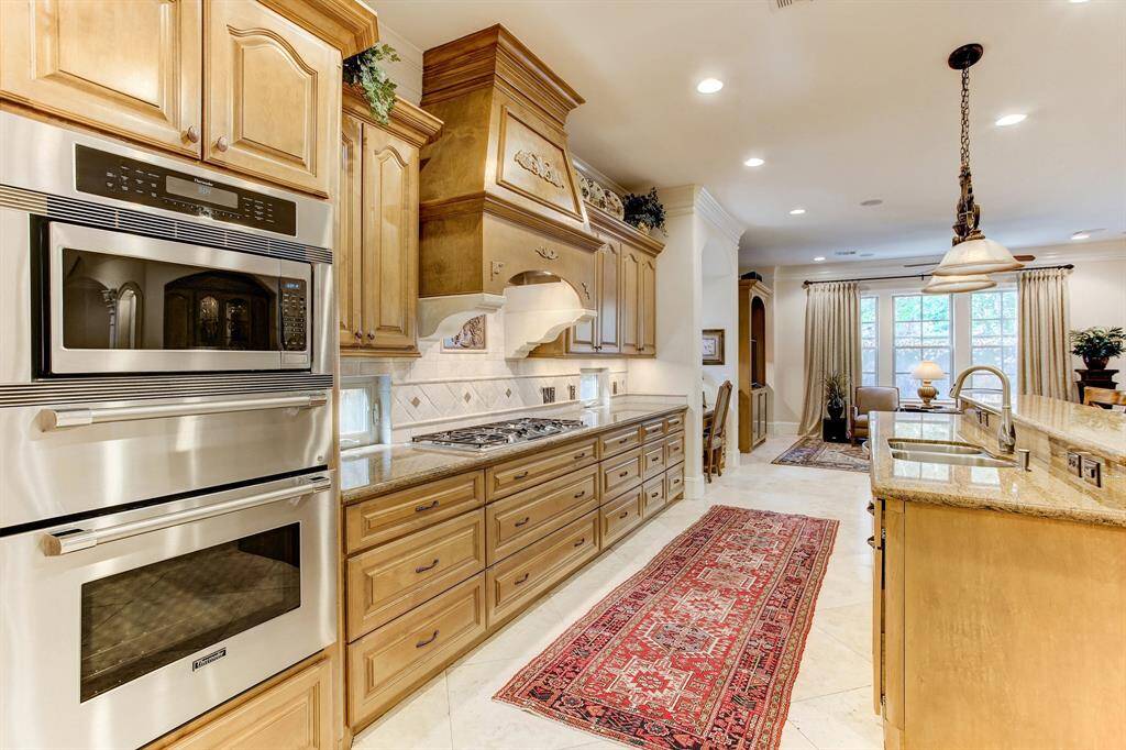 Fantastic kitchen for cooking but not missing the party.  There is so much storage for pots, pans and serving pieces.  The granite island has lots of seating.  There are stainless Thermador appliances, side by side Subzero full size refrigerator and freezer and a butlers pantry.