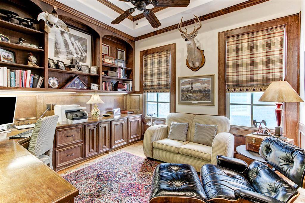 The handsome library upstairs has high ceilings, hardwood floors and plenty of wood cabinets and book shelves.  It makes a great escape for working from home.