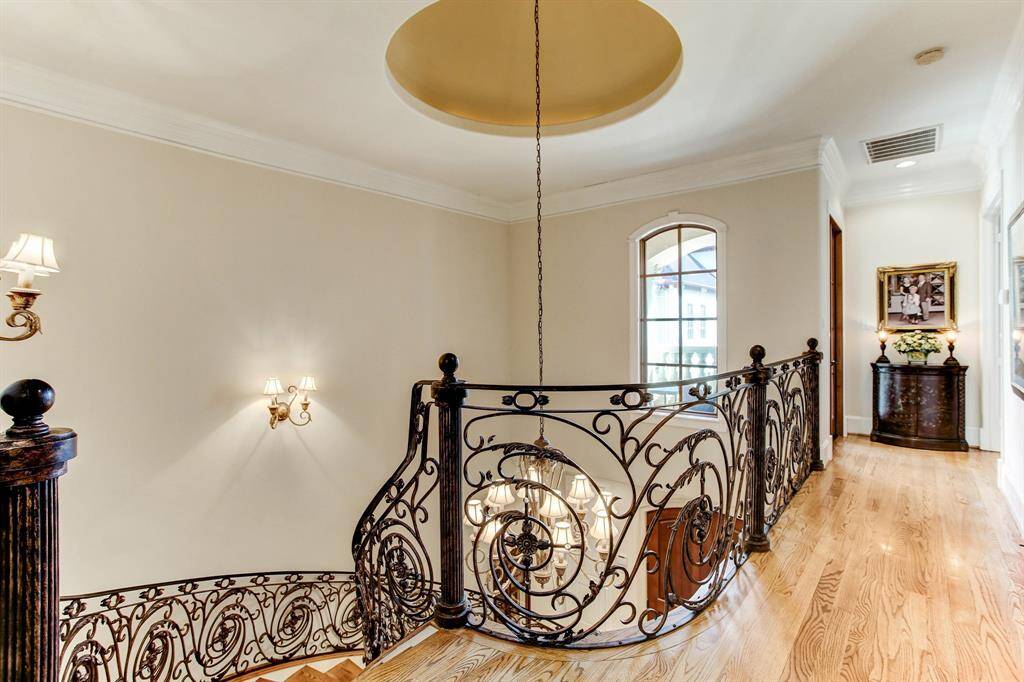 The 2nd floor landing has hardwood floors.  The primary bedroom is to the right and to the left is a cozy balcony area great for relaxing.