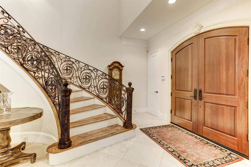 Another view of the entry focusing on the double wood doors.