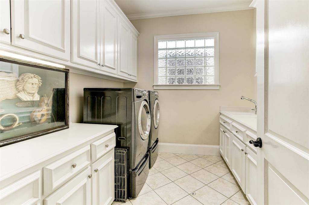 Convenient 2nd floor utility room is quite large with abundant storage and sink.