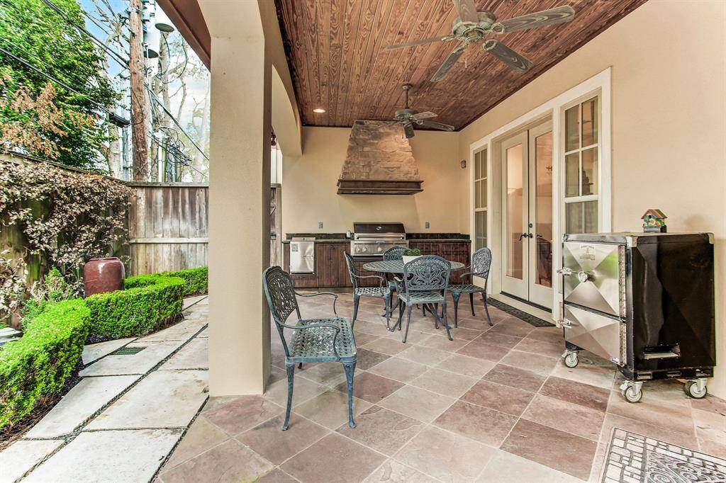 A view of the outdoor covered loggia showing the outdoor kitchen.