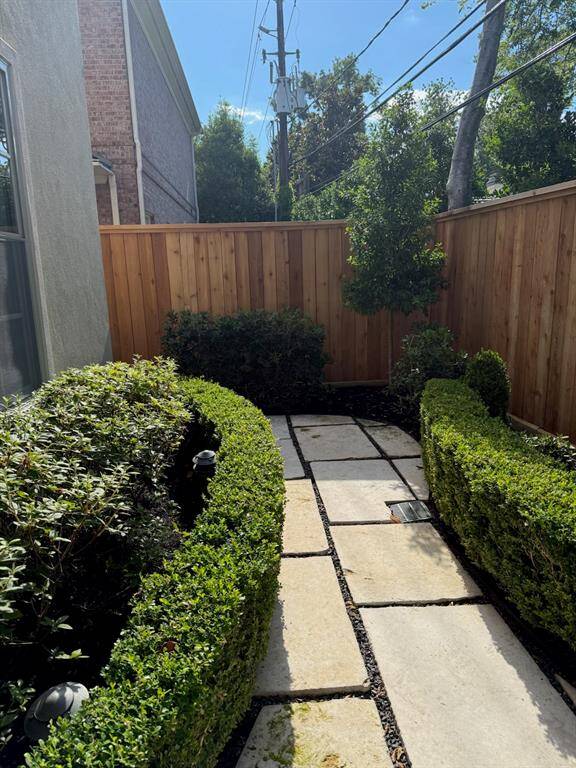 Another view of the courtyard walkway showing the recent fence.