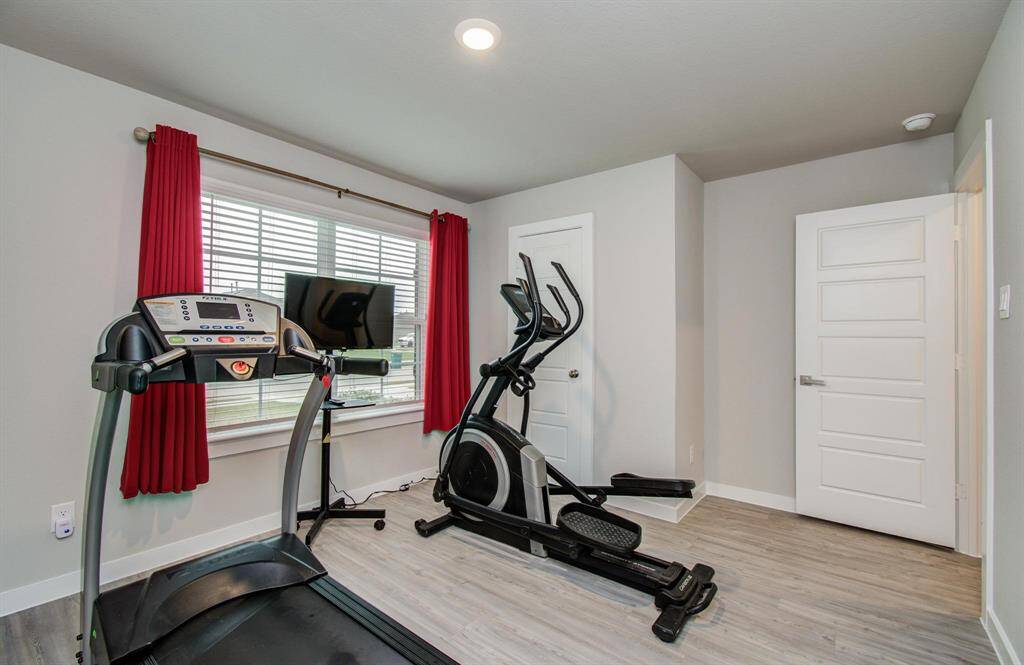 Additional Bedroom comes equipped with cardio machines for the burn at home!