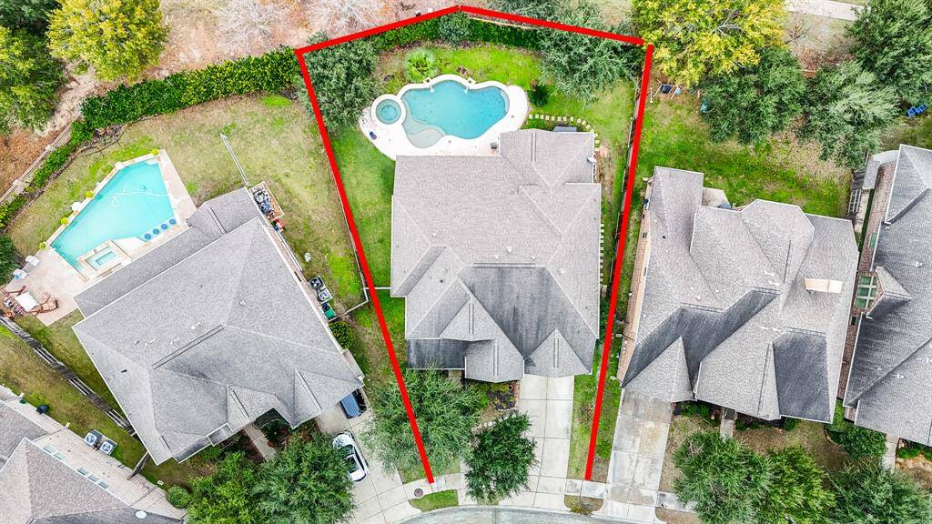 This home has a backyard oasis with covered patio, pool, and spa!