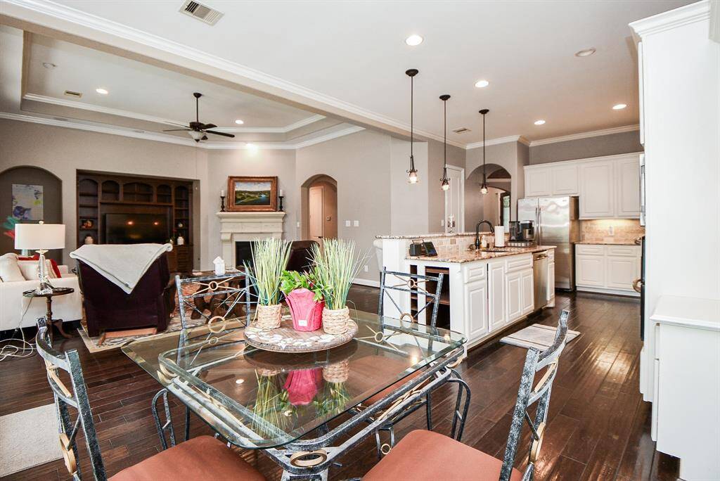 The breakfast room features windows with views in your backyardnext to the back door.