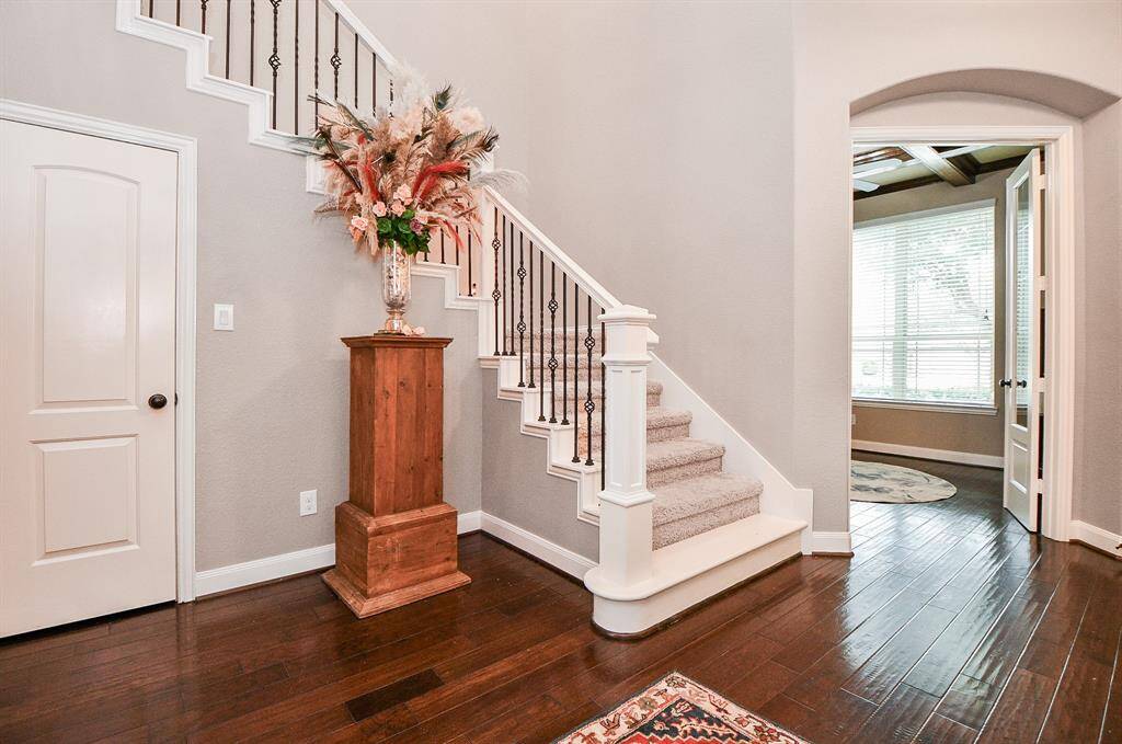 The carpeted staircase leads to the second floor.