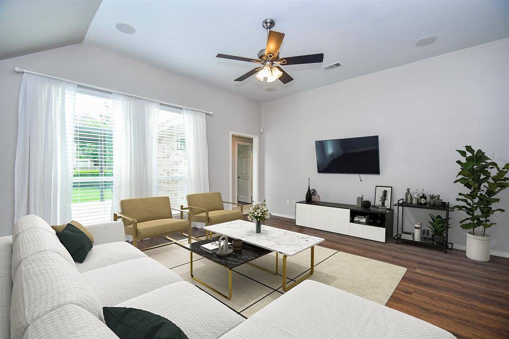 This open floor plan is perfect for today's modern family. Your 14' x 15' living room is open to your kitchen and casual dining area, this flow making hosting a BREEZE. The breakfast bar area makes the perfect buffet line during the holidays.  Note these GORGEOUS wood-look luxury vinyl plank throughout the home - NO CARPET!