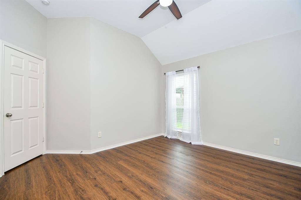 Bedroom #1 measures 10' x 13' complete with a large window to let in plenty of natural light, ceiling fan, and spacious closet. This photo is virtually staged.