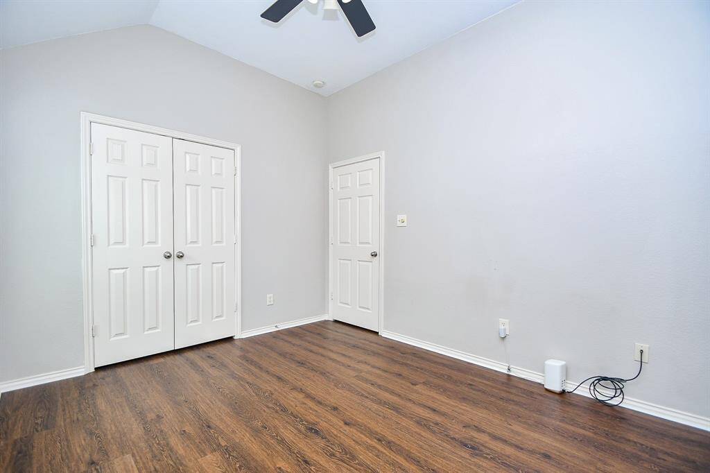 This bedroom also offers neutral paint, vaulted ceiling, and easy access to the full bathroom.