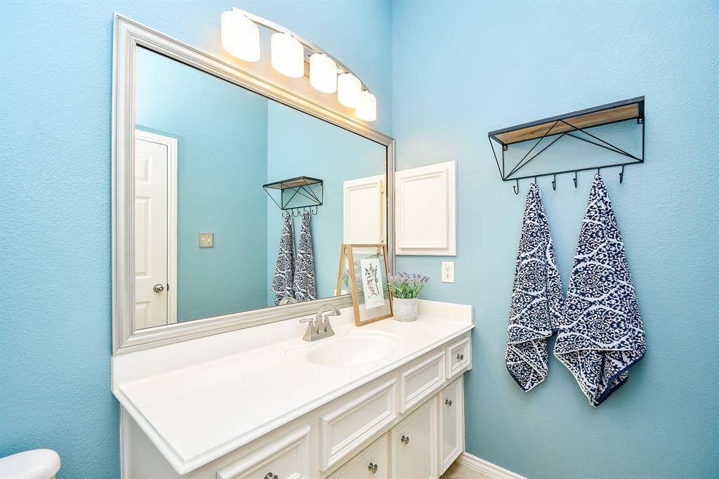 This welcoming bedroom also makes the perfect space for an enclosed study or play room, plenty of space for furnishings, games, toys, and more! This photo is virtually staged.