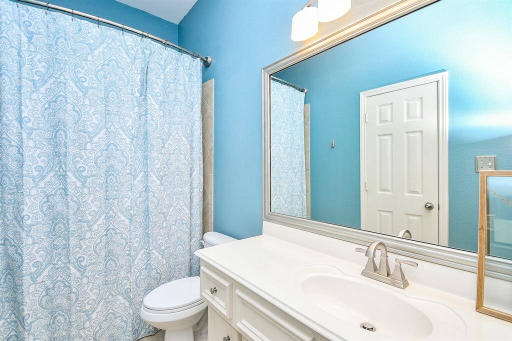 Your secondary bathroom measuring 5' x 10', easily accessed and shared by the three bedrooms! It is complete with an extended single sink vanity with plenty of space for toiletries, towels, and anything siblings may need.