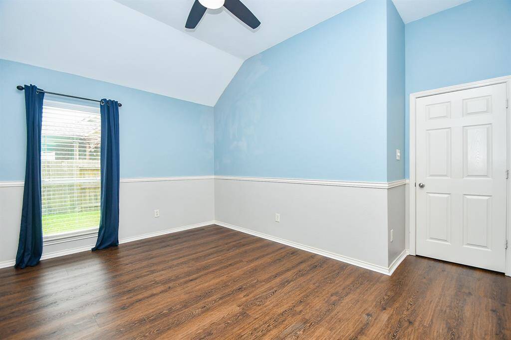 Bedroom #3 measures 11' x 12', complete with a large window to let in light, ceiling fan, and a SPACIOUS closet. This photo is virtually staged.