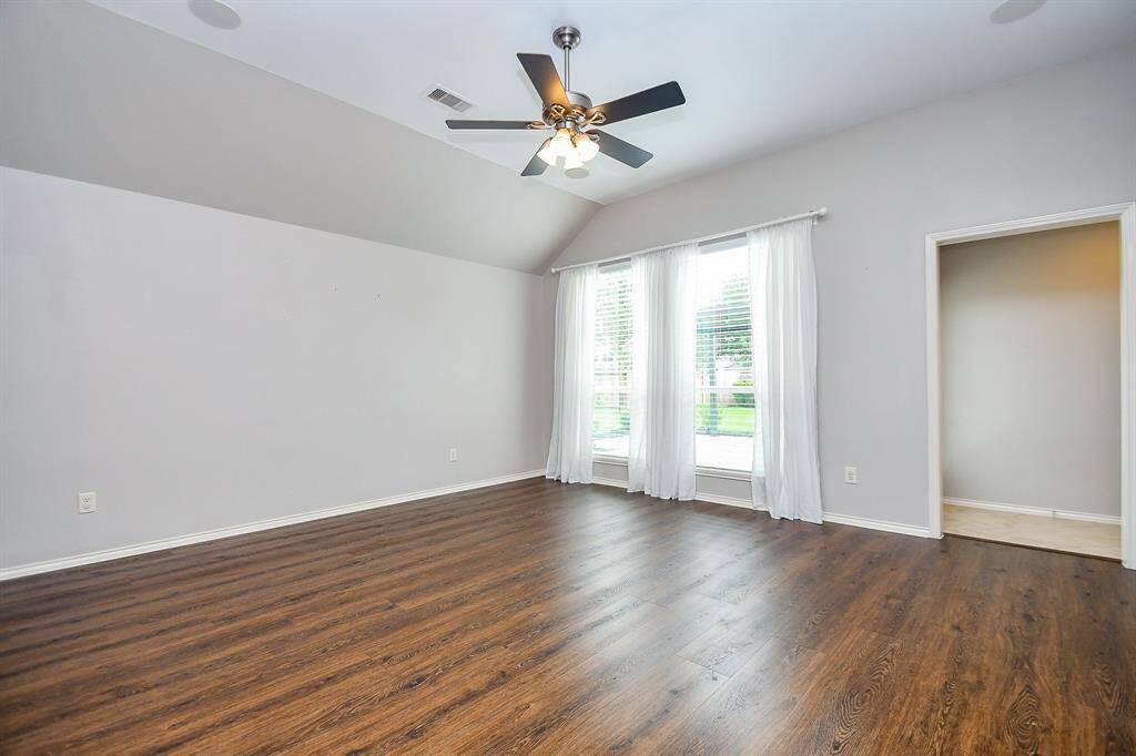 There is plenty of room to add or rearrange furniture as you wish!  Note the charming detail of chair rail trim and the upgraded floors to wood-look luxury vinyl plank also in all the bedrooms.