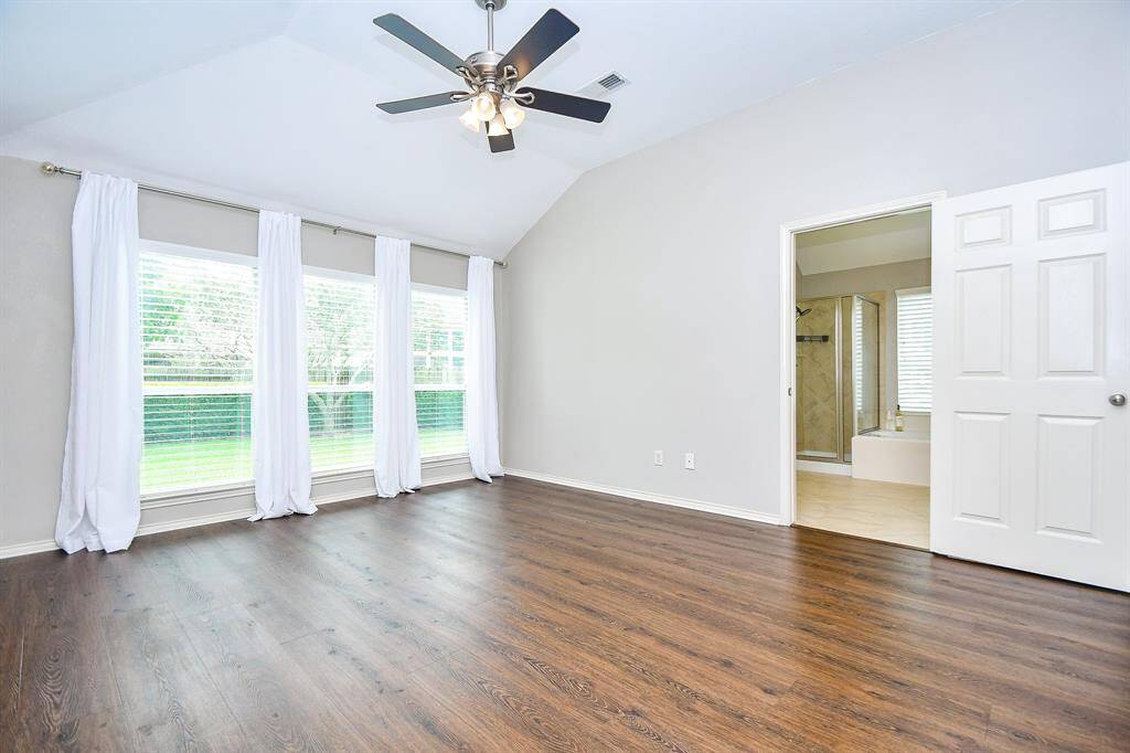 Follow me back to the living room, join me down this hallway so we can check out your new primary bedroom!