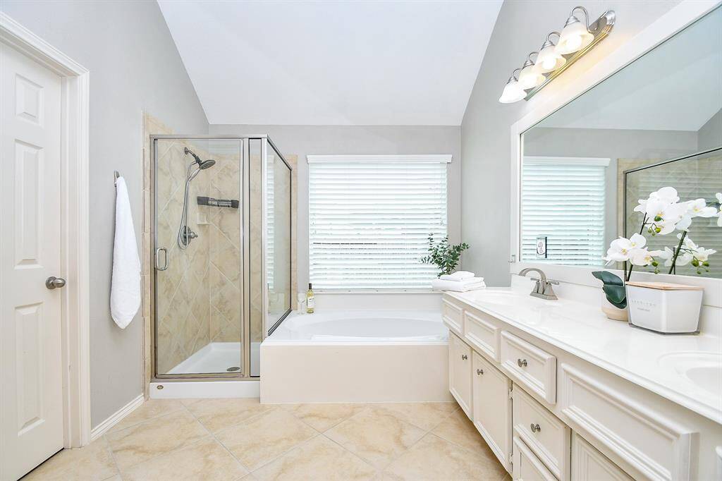 It also complete with vaulted ceilings, neutral paint, a ceiling fan, and beautiful wood-look luxury vinyl plank flooring, creating a calm and comfortable retreat you’ll love coming home to. This photo is virtually staged.