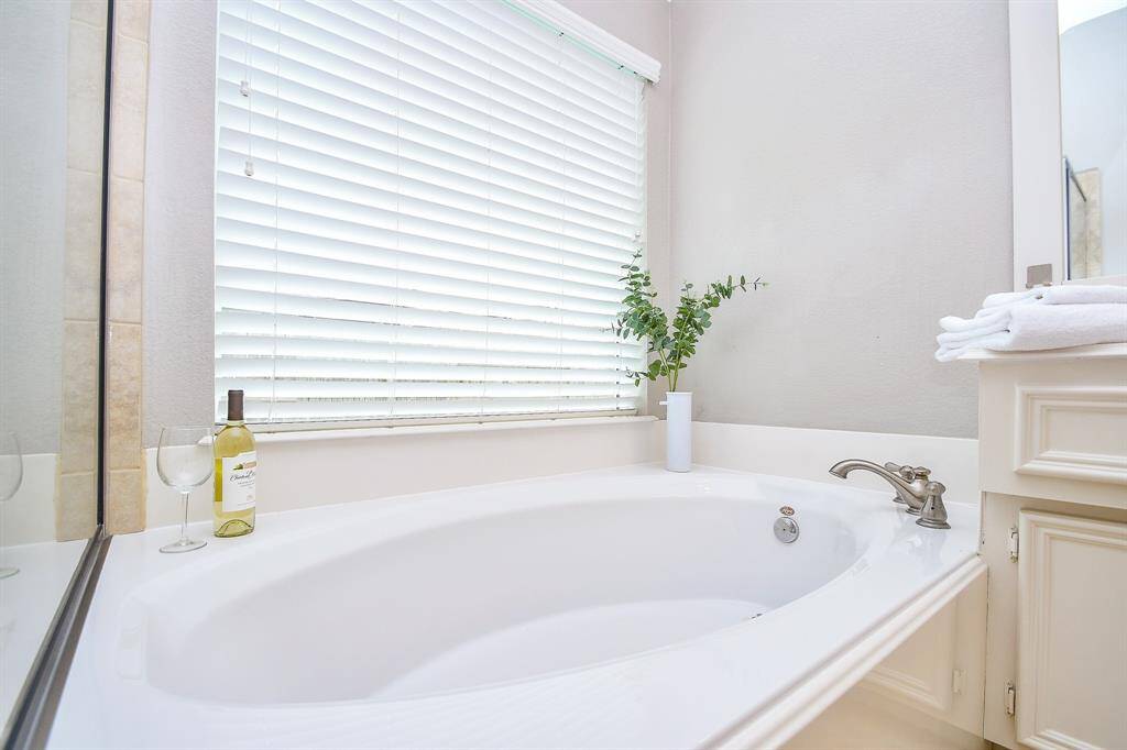 Your 8' x 10' primary bathroom has everything you'll need to prepare for the busy day ahead and to relax after your long, productive day! You have double sinks, plenty of cabinets for toiletries and towels, plenty of counterspace for your routines, as well as a stand-up shower with tile-surround and a soaking tub.