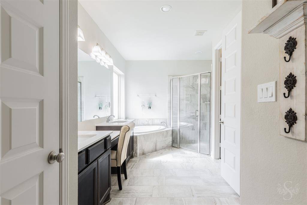 From every angle, the primary bath exudes tranquility with light-filled space, polished finishes, and a calming neutral palette. The spacious layout allows for ultimate relaxation and privacy.