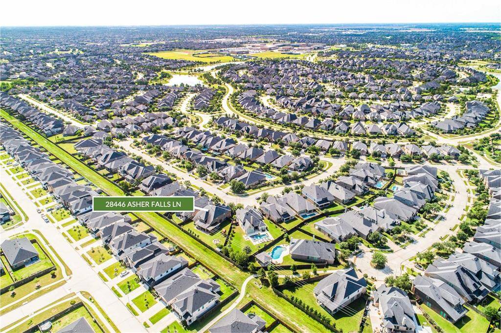 Aerial showing the pool-sized back yard. Take in the expansive view of this vibrant master-planned community of Cross Creek Ranch, with 28446 Asher Falls Lane perfectly situated along a greenbelt with walking trails. Enjoy convenient access to nearby schools, parks, and resort-style amenities in every direction. Playground and pool within 0.25 miles away and all schools within 0.5 miles away!
