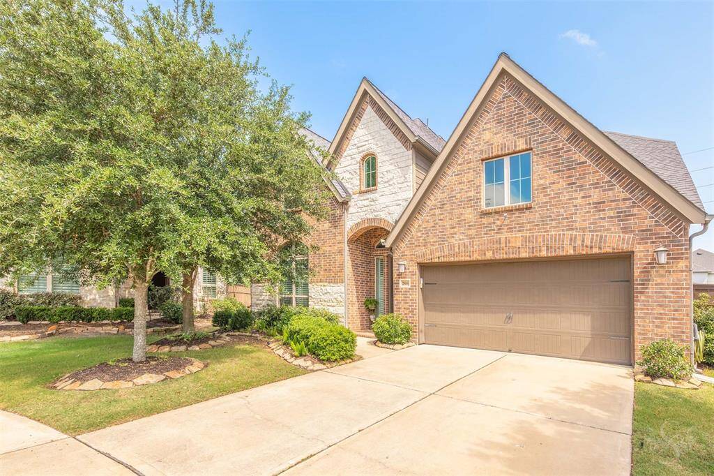 Impressive curb appeal with stone and brick façade, arched entry, and manicured landscaping welcomes you home. Exquisite luxury 2 story Perry Home offers timeless elegance & exceptional design with 4 bedrooms, 3.5 baths, and a spacious 3 car garage in CCR.