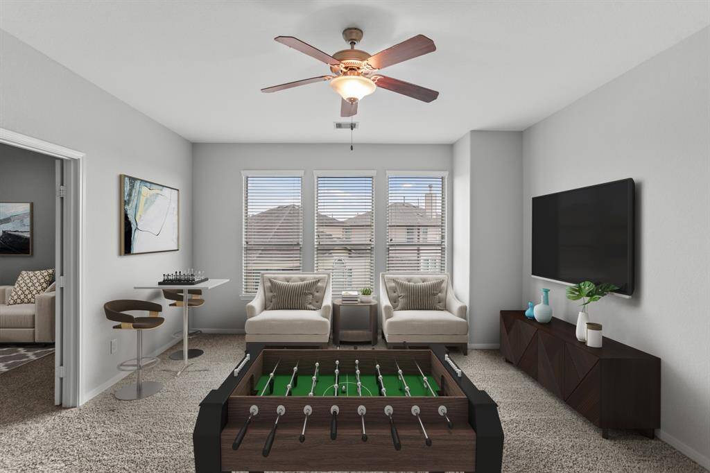 Virtually Staged: Conveniently upstairs is this fabulous game room! Complete with plush carpet, large windows with privacy blinds, and a ceiling fan. Convert this space into a kids' hangout, an adults hideaway, or whatever you can imagine!