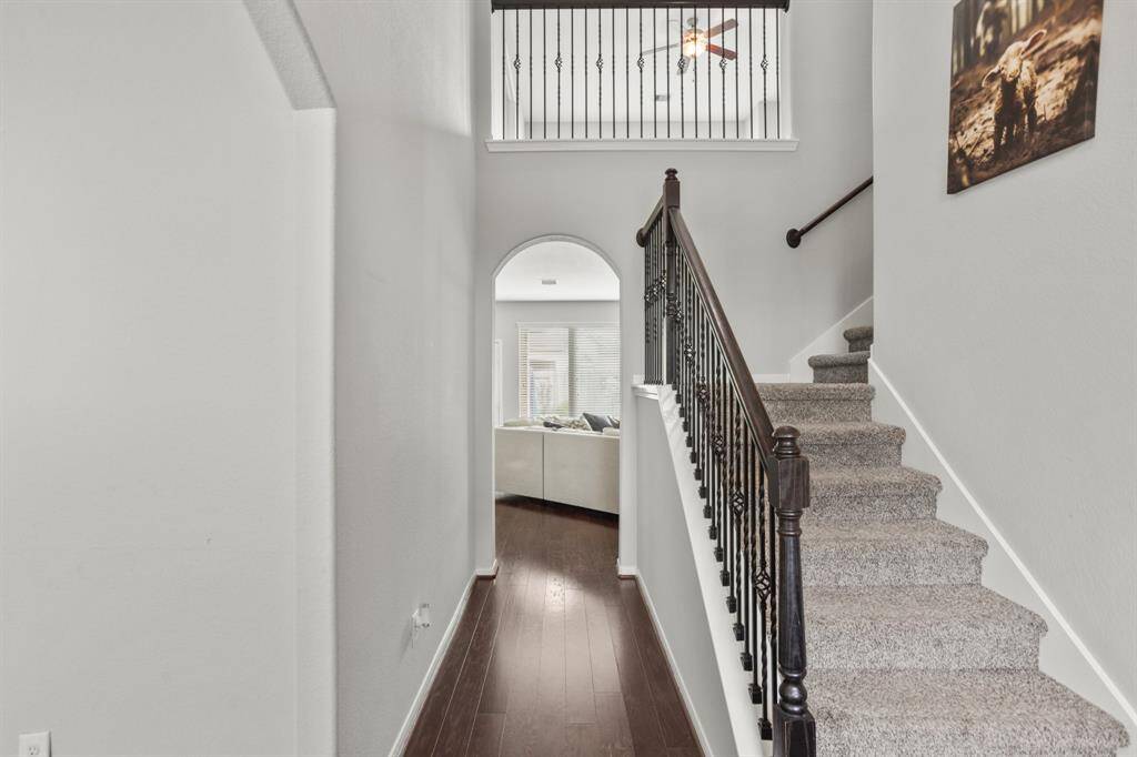 You'll be instantly greeted by beautiful wood floors, a charming stair case, and a view straight back into the backyard!