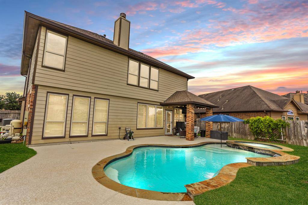 This backyard features solid board fencing providing more privacy.