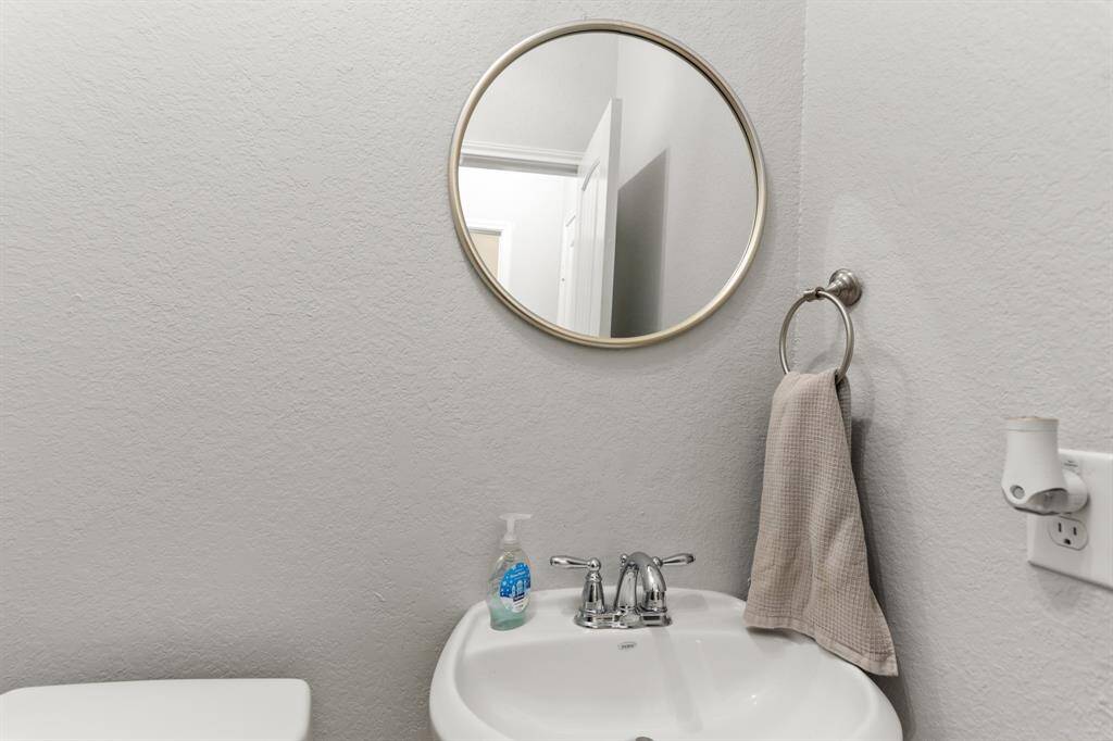 This well-appointed half bathroom is great for when you have family, friends, and guests over.