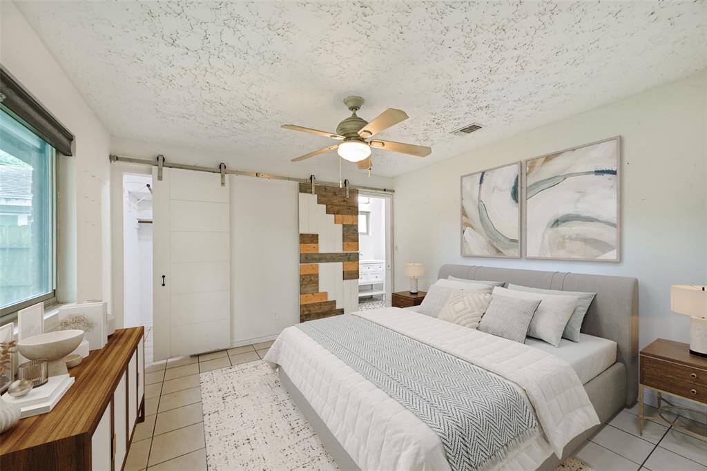 Primary bedroom offers a private en-suite bath