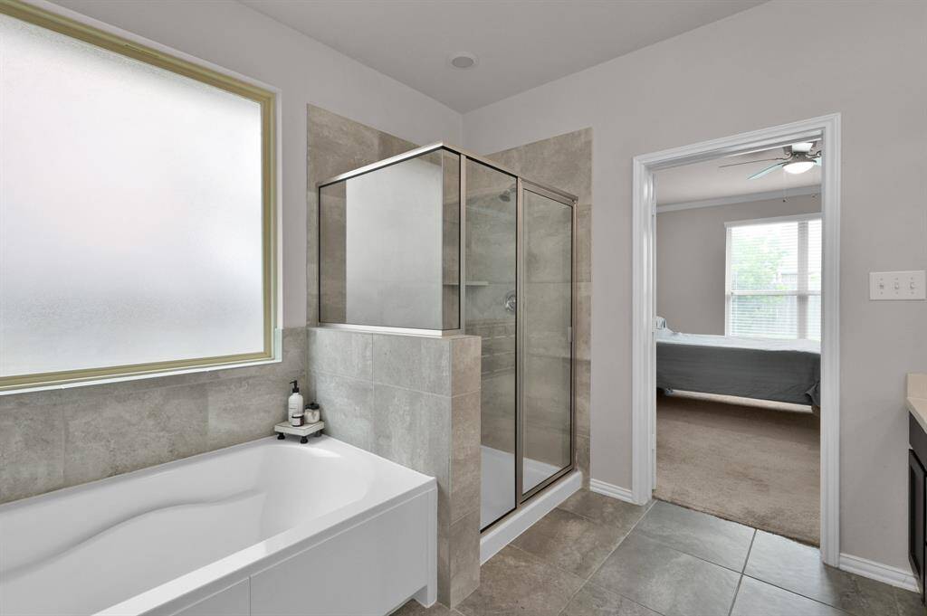 The primary bathroom tops it off with a like-new soaking tub and walk-in shower.