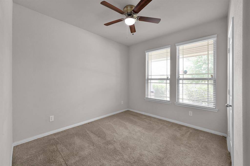 Secondary bedroom in the front of the home. It is light, bright and has plenty of space.
