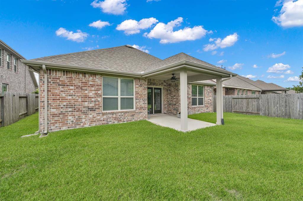 This home is one of the builder's plans that included brick on both the front and back of the home.