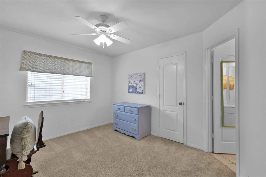 This bedroom has an en suite bathroom that is shared to the aforepictured hallway