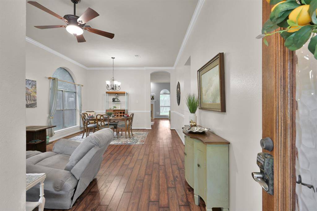 Lofty ceilings and light greet you when you walk into this one story, 4 bedroom home.