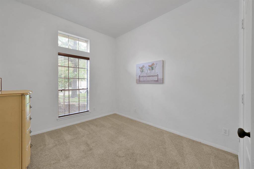 This bedroom is the first one down the long hallway, to the right