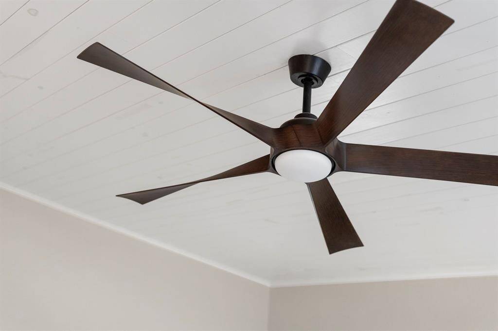 Modern lighted ceiling fan and additional energy-efficient light fixtures, all installed in 2022, enhance both comfort and sustainability.