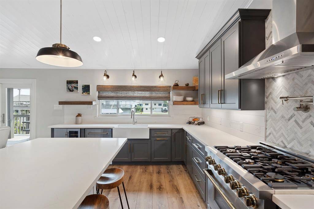 Classic beadboard ceiling adds architectural charm and texture, beautifully complemented by recessed, energy-efficient LED lighting for a warm, inviting glow.