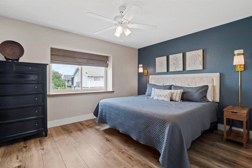The spacious primary bedroom features a large window that fills the room with natural light, a spacious walk-in closet, and a private en suite bathroom for added comfort and convenience.