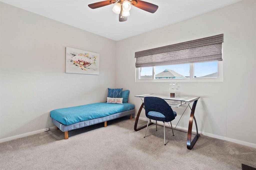 This home offers three well-appointed bedrooms, providing ample space for family, guests, or a home office. Woven wood blinds installed in bedrooms and kitchen in 2022.